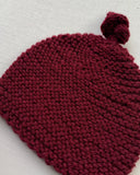 Knitted by Nana Top Knot Beanie - Sangria