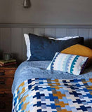 Uimi Max Double Sided Cross Pattern Merino Blanket. Size: Cot. Colour: Curry