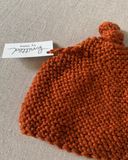 Knitted by Nana Top Knot Beanie - Rust