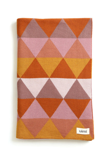 Uimi Indiana Double Sided Triangle Blanket in Merino Wool. Size: Bassinet. Colour: Sunrise