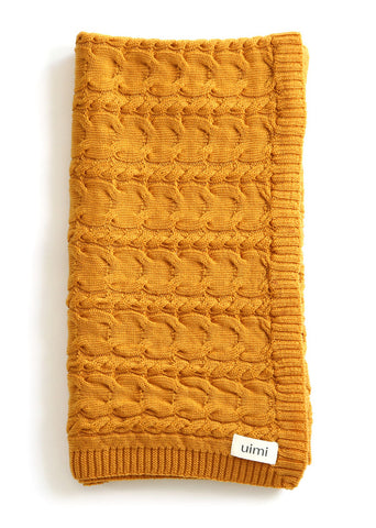 Uimi Valentina Cable Merino Blanket. Size: Bassinet. Colour: Sunrise